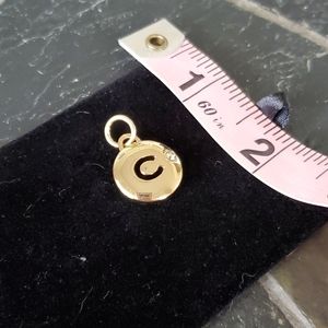 Coach signature C Disc charm
